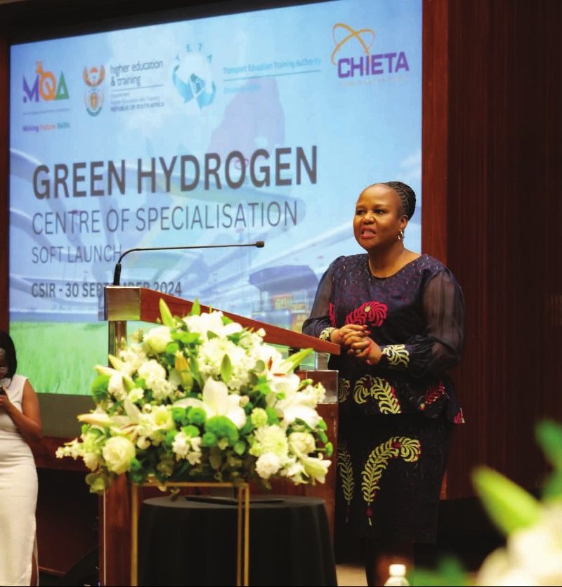 Speaker at the podium at the Green Hydrogen Centre of Specialisation soft launch