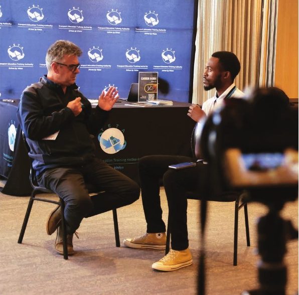 Wandii interviewing a stakeholder on camera at World Maritime Day